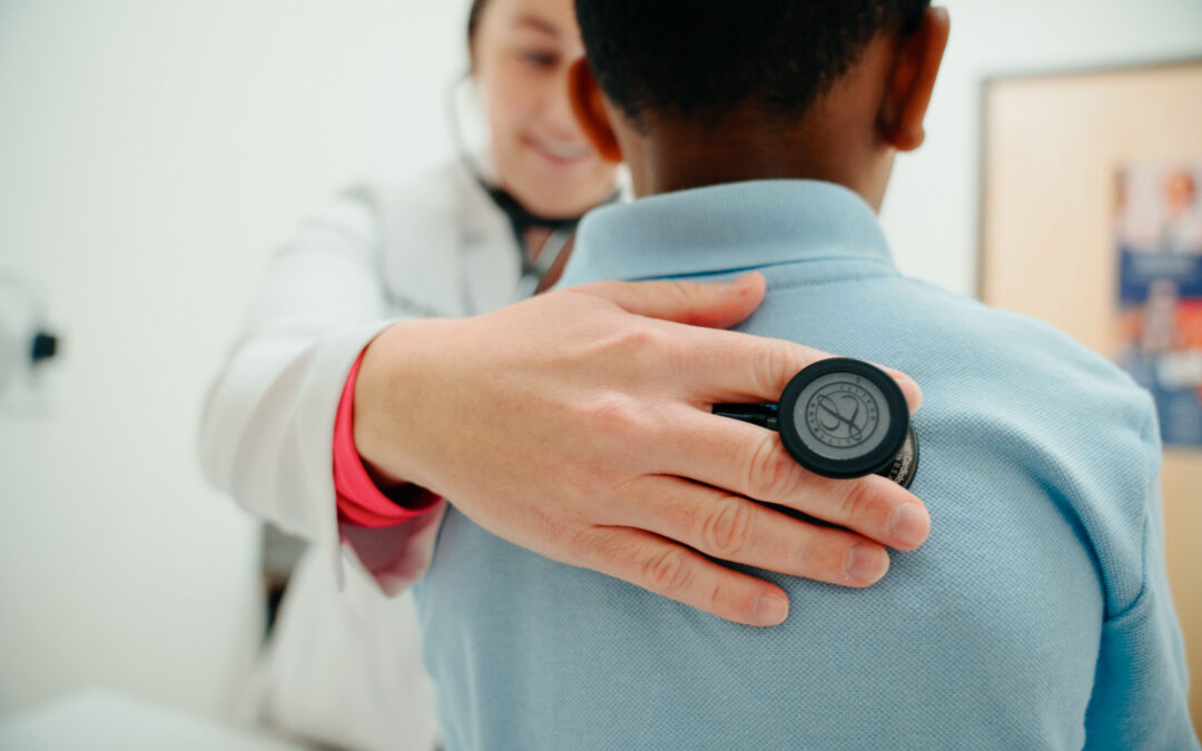 AFC provider checking patient's lungs
